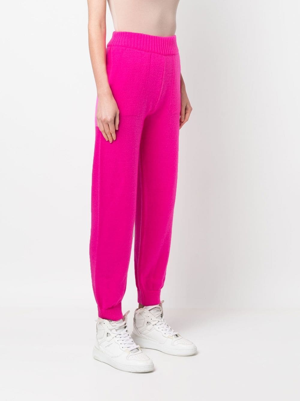 a women wearing pink pants
